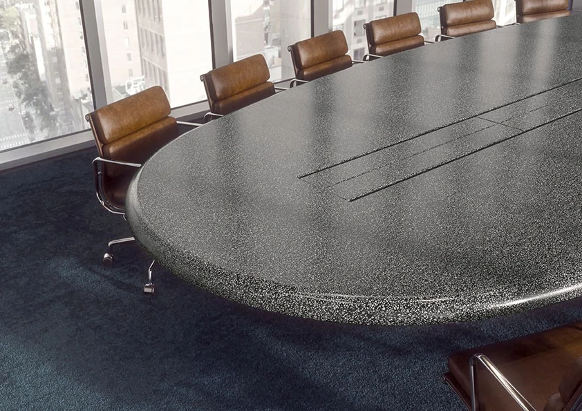 Mesa de reuniones de Corian® Basalt Terrazzo en una sala de juntas